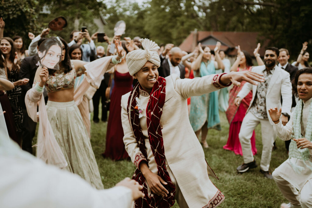 Couple dancing with family and friends on their wedding day